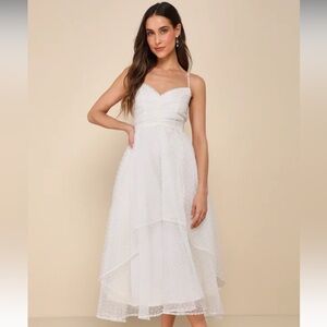 Lulu’s pleated ivory Swiss dot dress.